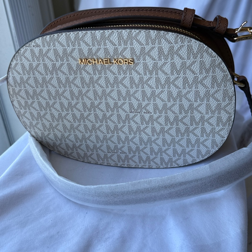 NWT - Michael Kors Cream MK Logo Oval Crossbody with Brown Leather Trim.